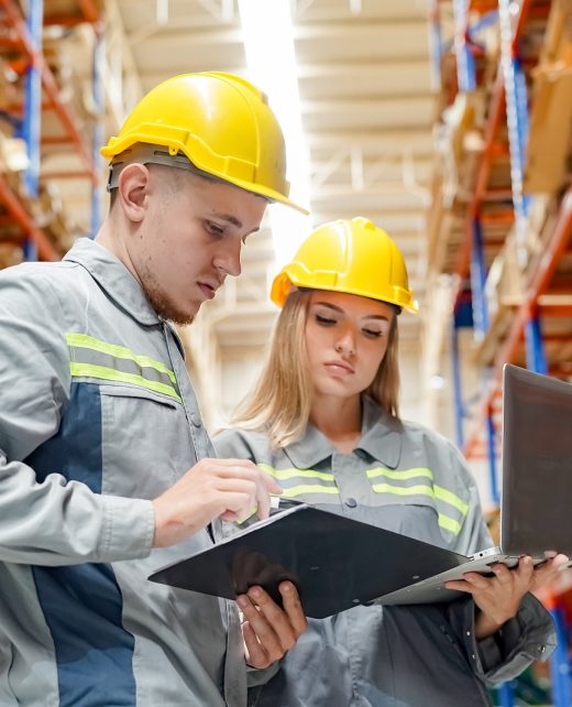 Warehouse Industrial supply chain and Logistics Companies inside. Warehouse workers checking the inventory. Products on inventory shelves storage. Worker Doing Inventory in Warehouse. Dispatcher in uniform making inventory in storehouse. supply chain concept
